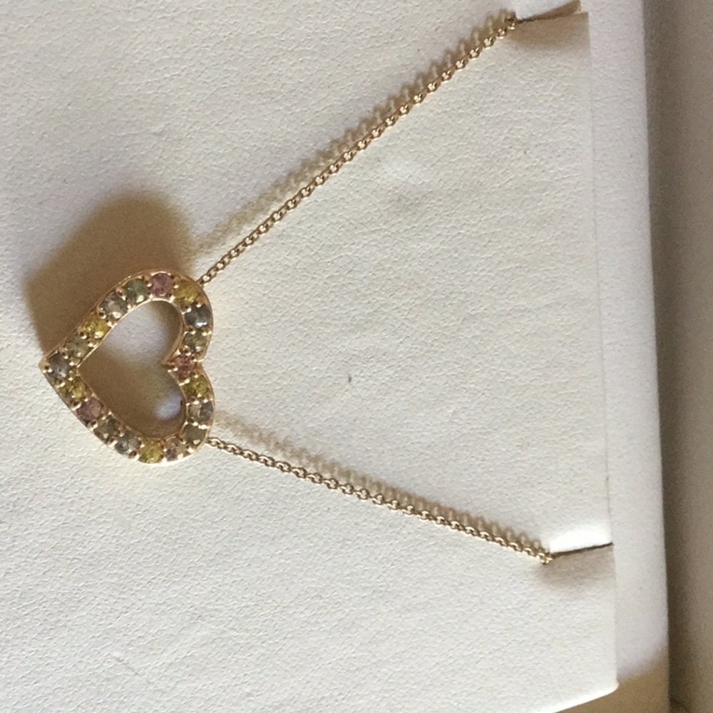 Heart necklace with multi colored gemstones.